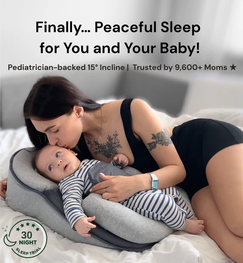 Baby resting comfortably in an inclined baby nest