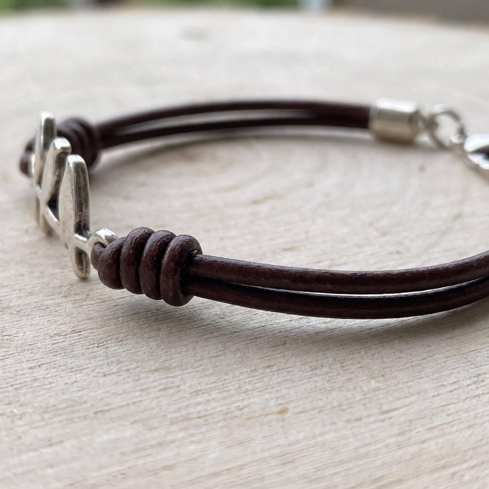Close view of the leather cords and coiled knots